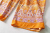 Bas du pantalon de la combinaison fleurie orange pour femme | Couleur Florale